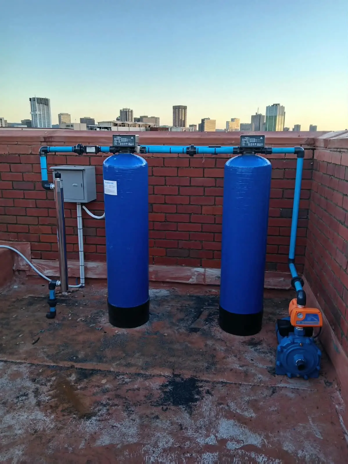 Borehole pump pipework connected to a water storage tank
