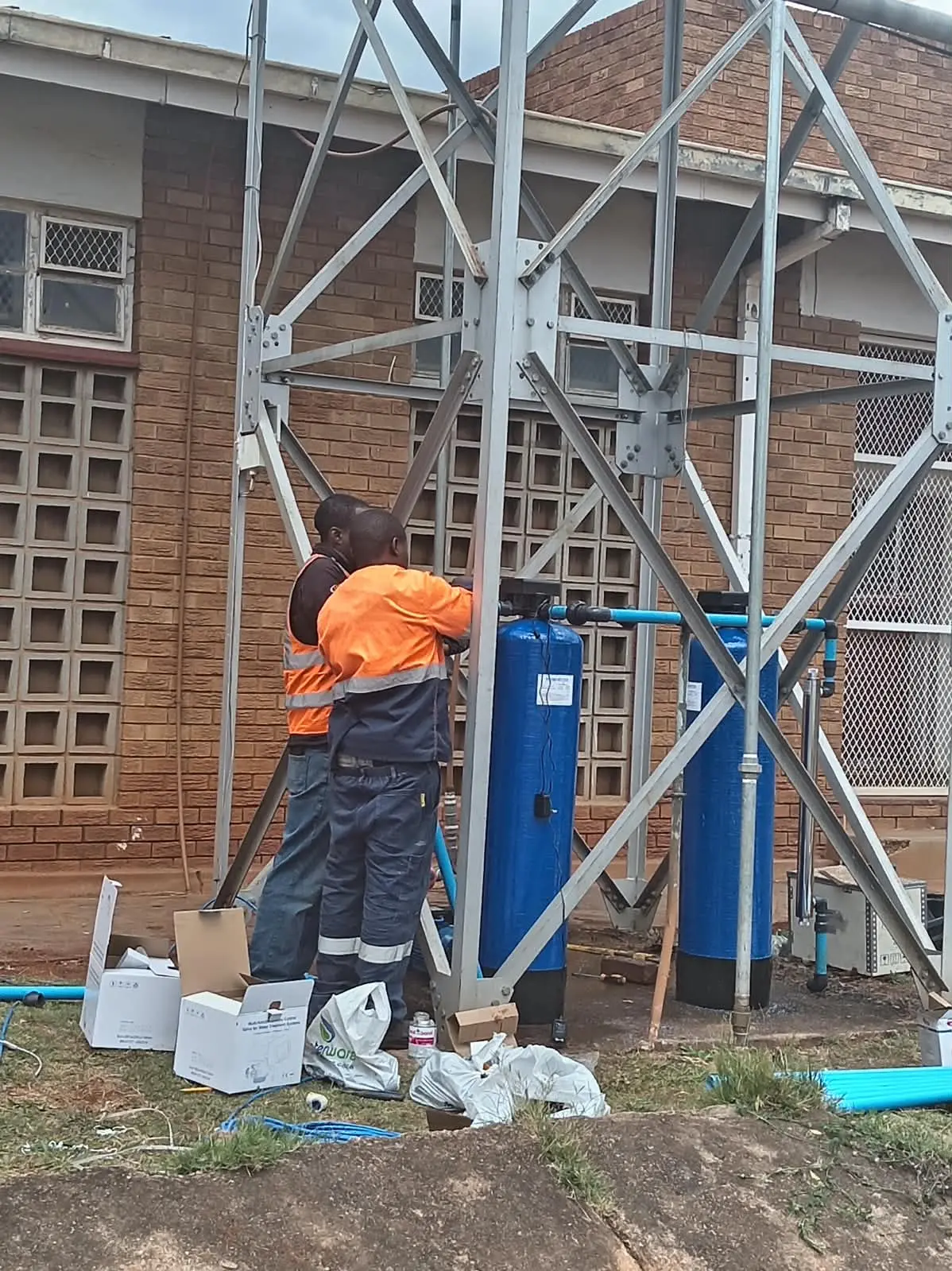 Borehole drilling rig positioned safely on a residential property