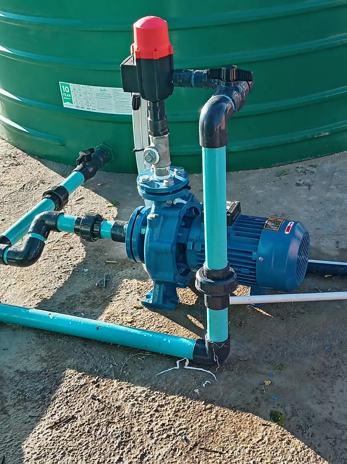 Borehole drilling truck and compressor completing a water project